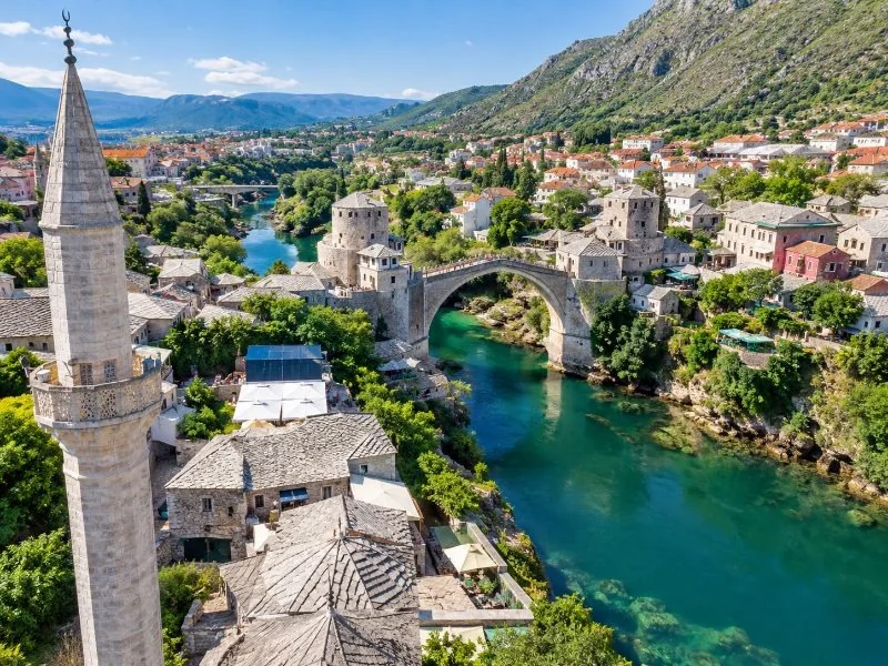 View over Mostar's Old Town rooftops and the Old Bridge from a minaret